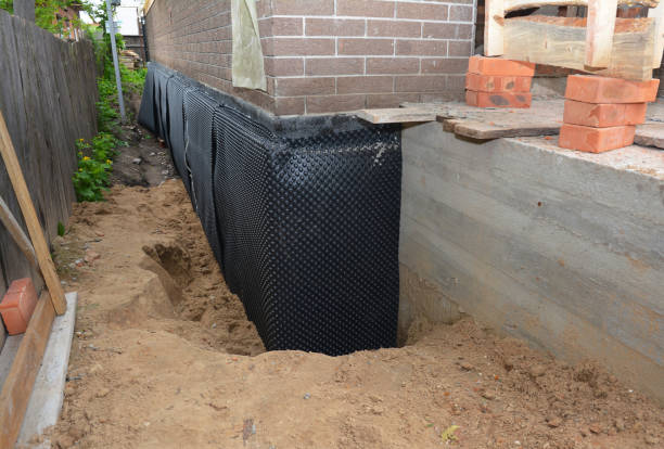 Happy homeowners after waterproofing job in South Haven